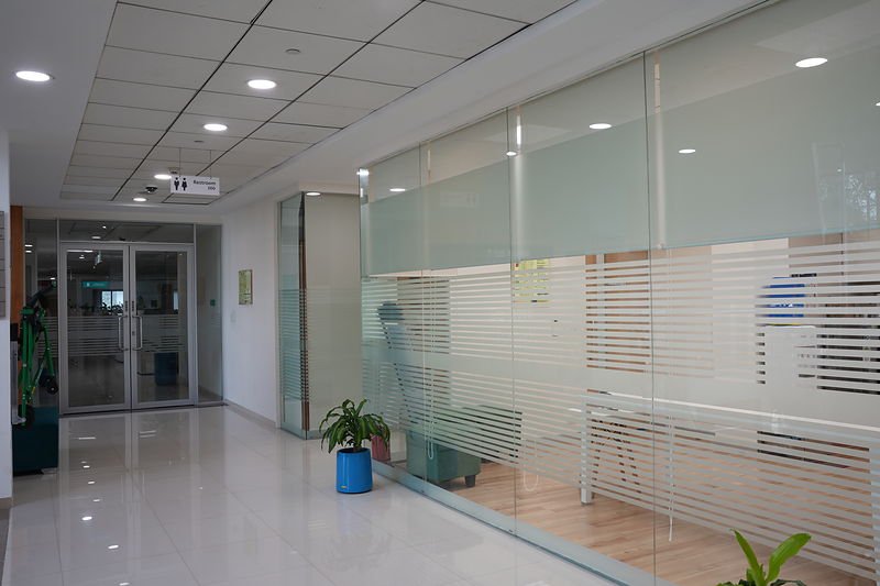 Typical floor lobby with glazed office entry and a partitioned reception area.