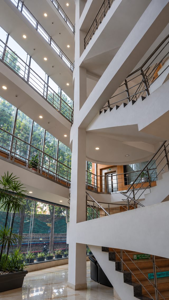 Full-height central atrium bringing daylight into the floor lobbies on every level.