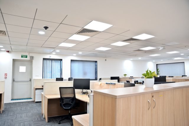 Open plan office floor handed over fitted, with workstations, lighting and cabling in place.